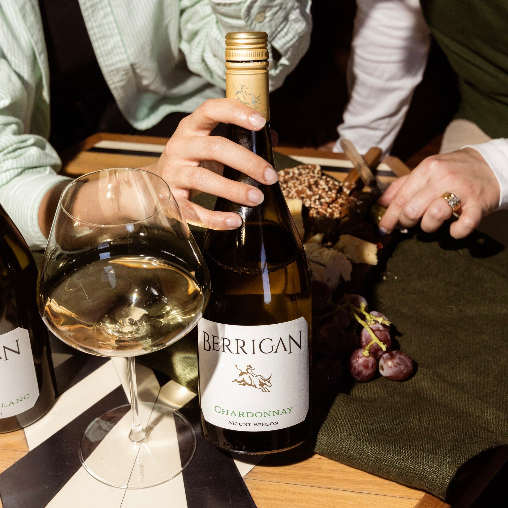 Berrigan Chardonnay bottle being shared at the table